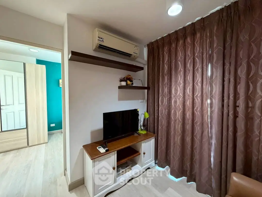 Cozy living room with air conditioning and stylish decor in modern apartment.