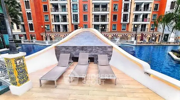 Luxurious poolside view with stylish loungers in a modern residential complex