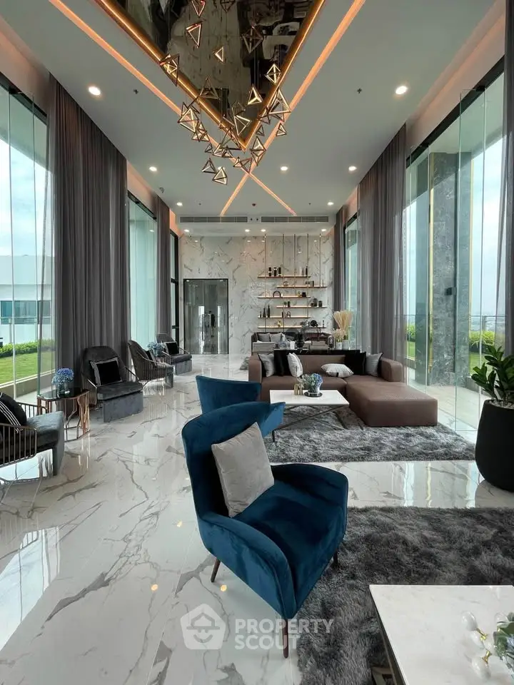 Luxurious modern living room with marble floors, plush seating, and floor-to-ceiling windows offering stunning views.