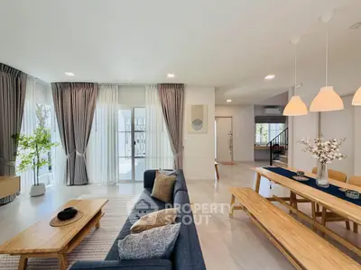 Spacious modern living room with elegant dining area and natural light