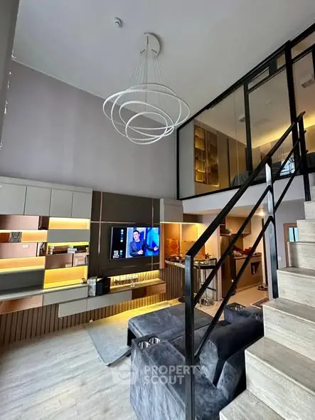 Modern living room with high ceiling and stylish staircase in a luxury apartment