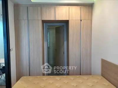 Modern bedroom with built-in wardrobe and ensuite bathroom