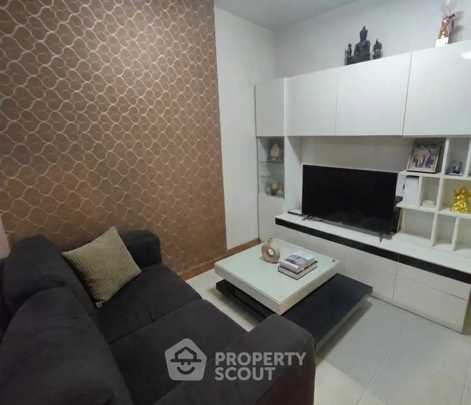 Modern living room with stylish decor and entertainment center