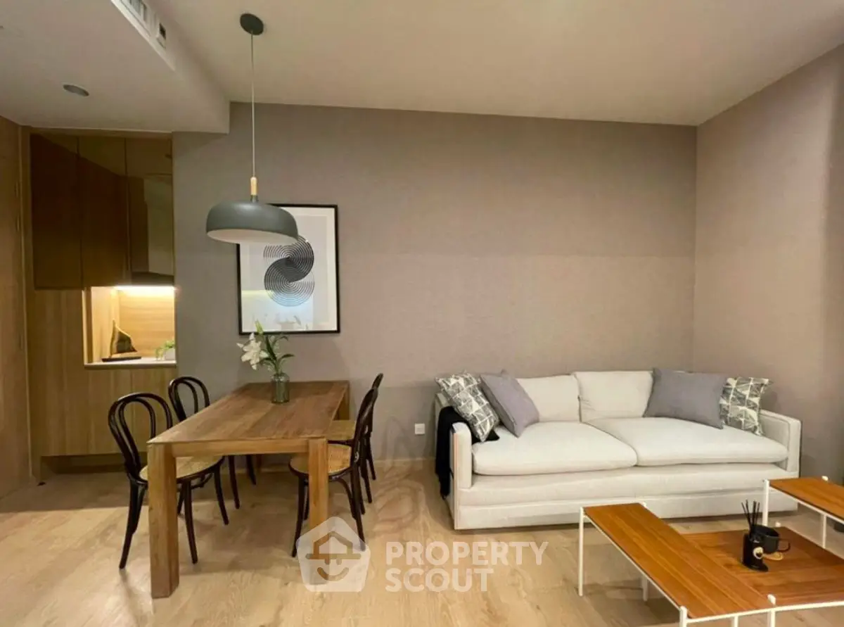 Modern living room with cozy sofa and elegant dining area