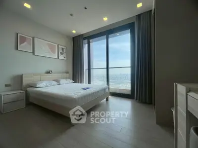 Modern bedroom with stunning city view and minimalist decor