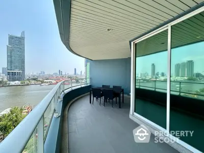 Spacious balcony with stunning river view in modern high-rise apartment