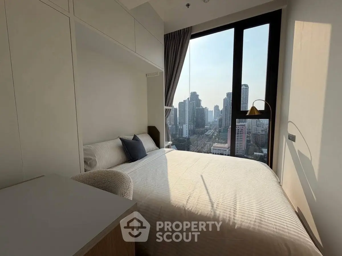 Modern bedroom with stunning city view and natural light