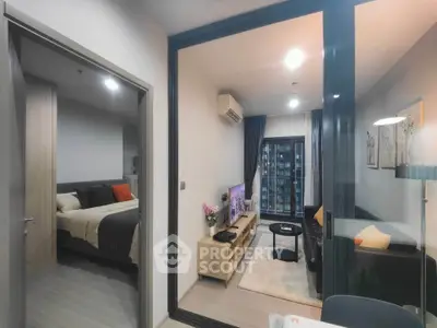 Modern apartment with cozy living room and bedroom, featuring stylish decor and natural light.