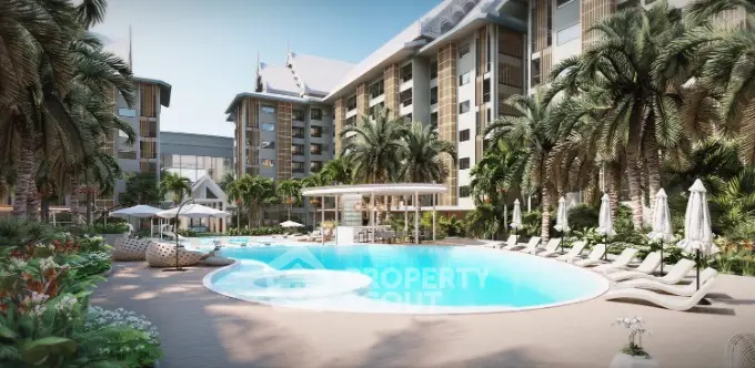 Luxurious tropical resort-style pool surrounded by lush greenery and elegant loungers, offering an oasis of relaxation in a high-end residential complex.