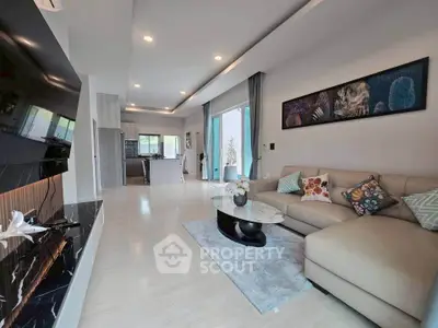 Spacious modern living room with open kitchen and elegant decor