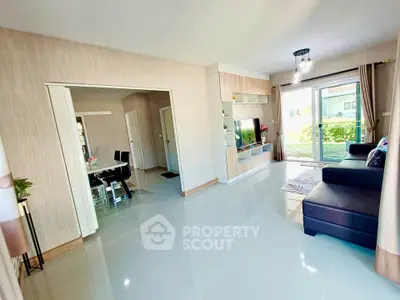 Spacious living room with modern decor and garden view