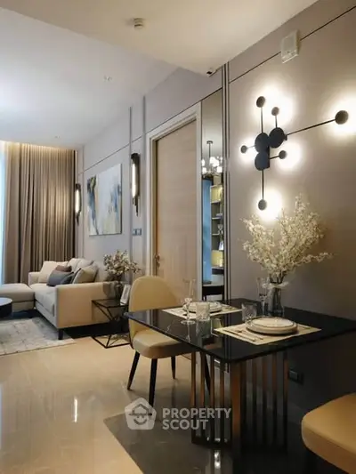 Elegant modern living room with dining area, stylish decor and cozy ambiance.