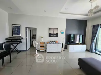 Spacious modern living room with sleek tile flooring and stylish decor