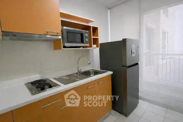 Modern kitchen with sleek cabinets and stainless steel appliances