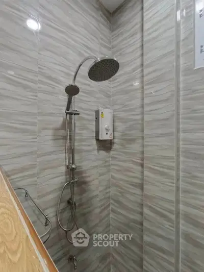 Modern bathroom shower with sleek tile design and rainfall showerhead