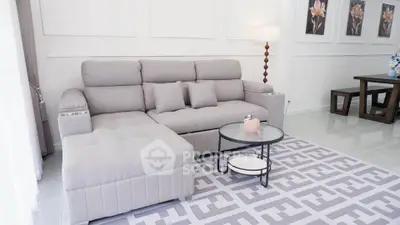 Elegant living room with modern gray sectional sofa and stylish decor