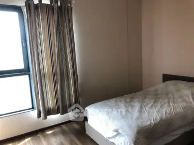 Cozy bedroom with natural light and modern decor