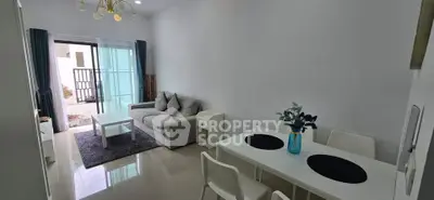 Modern living room with sleek furniture and natural light, perfect for stylish urban living.