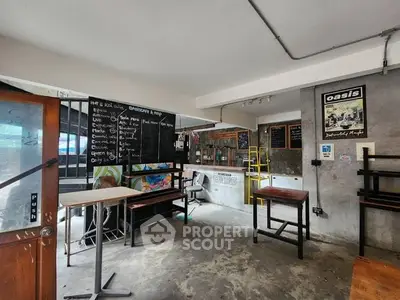 Trendy cafe interior with industrial design and chalkboard menu