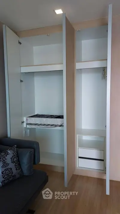 Modern apartment interior with built-in storage and cozy seating area