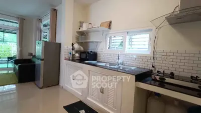 Modern kitchen with gas stove and sleek design in open layout apartment