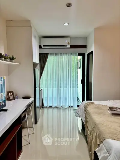 Modern bedroom with balcony access and sleek interior design