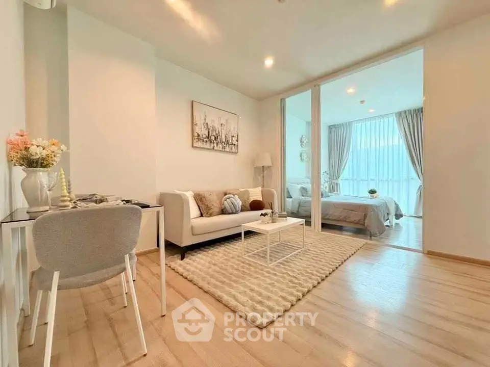 Modern open-plan living room with cozy decor and natural light