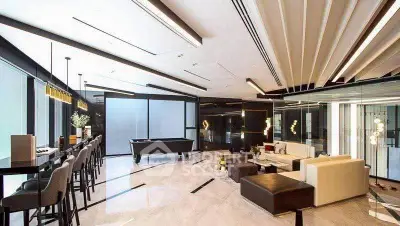 Luxurious modern living room with sleek design and pool table, perfect for entertaining.
