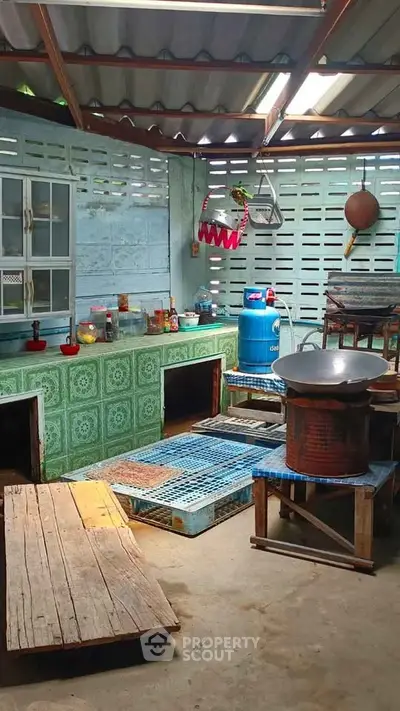 Rustic kitchen with open layout and traditional cooking setup
