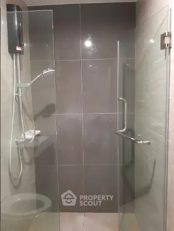 Modern bathroom with glass shower enclosure and sleek design