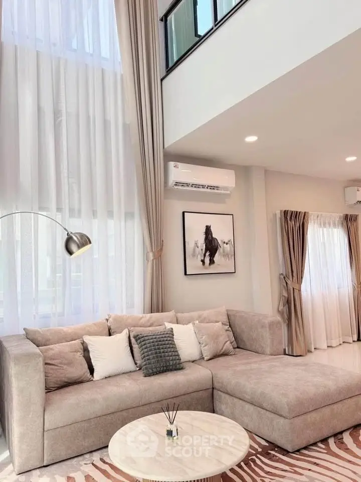 Luxurious living room with high ceilings and elegant decor