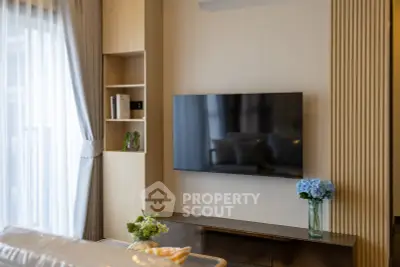 Modern living room with wall-mounted TV and elegant decor
