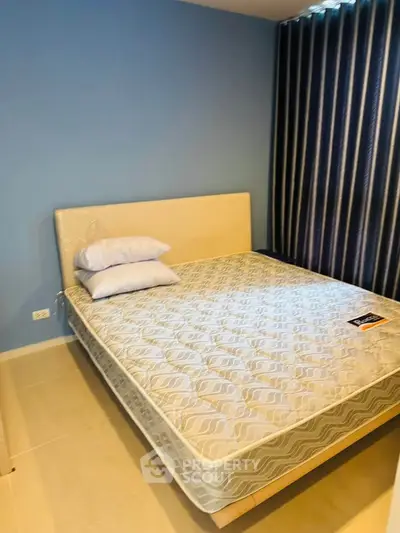 Cozy bedroom with modern decor and comfortable bed in a stylish apartment.