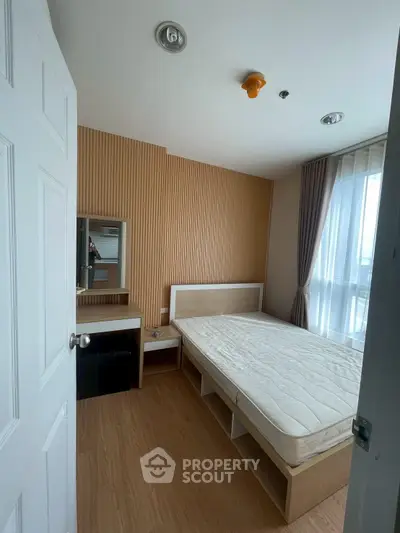 Cozy bedroom with natural light and modern furnishings