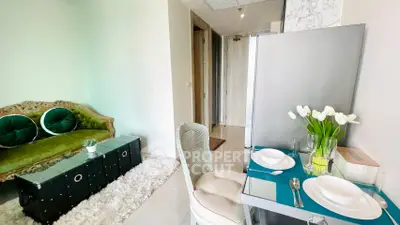 Chic living room with elegant decor and dining setup, perfect for modern urban living.