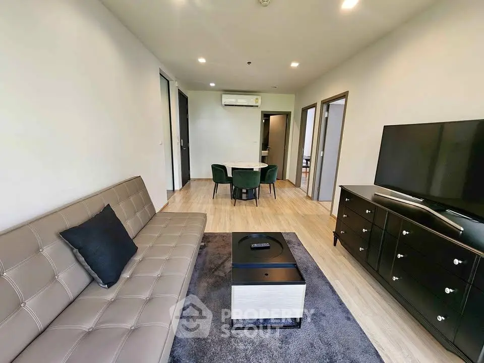Modern living room with sleek furniture and open layout, perfect for urban living.