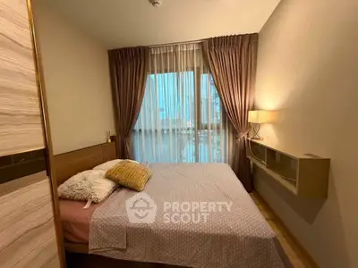 Cozy bedroom with elegant curtains and soft lighting, perfect for relaxation and comfort.
