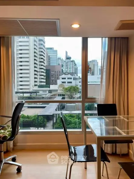 Modern apartment with city view, featuring glass dining table and sleek chairs, perfect for urban living.
