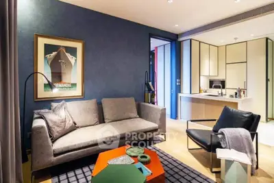 Modern living room with stylish furniture and open kitchen layout, perfect for urban living.