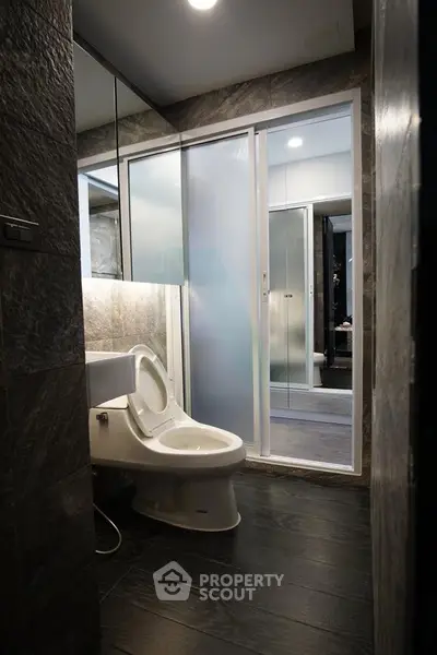 Modern bathroom with sleek design and glass shower enclosure