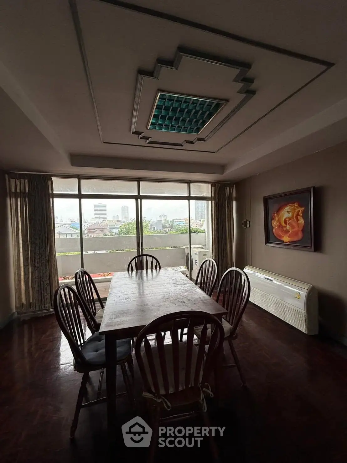 Spacious dining room with city view and elegant ceiling design