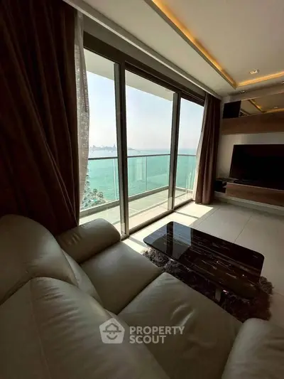 Luxurious living room with stunning ocean view and modern balcony