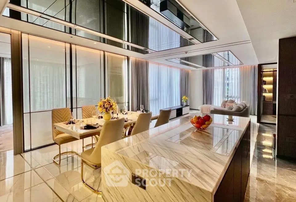 Luxurious open-plan living and dining area with elegant marble finishes