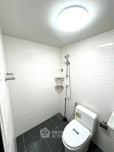 Modern bathroom with sleek white tiles and contemporary fixtures
