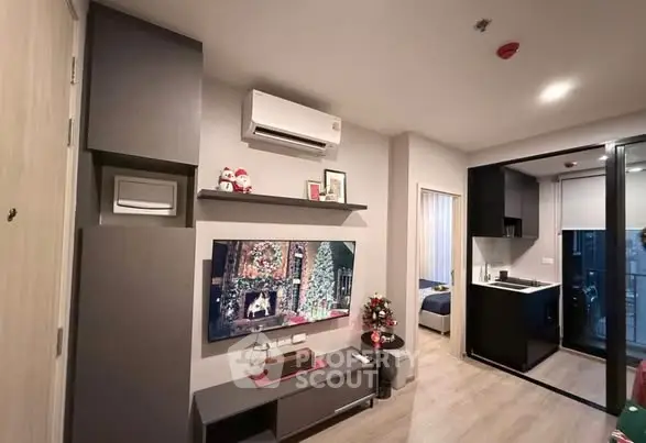 Modern living room with open kitchen and festive decor