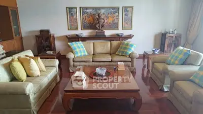 Elegant living room with plush sofas and artistic decor