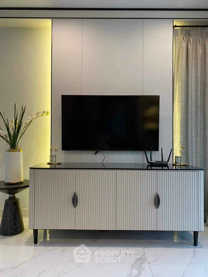 Modern living room with sleek TV stand and elegant decor