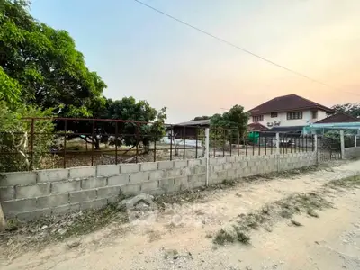 Charming suburban home with spacious yard and lush greenery, perfect for family living.