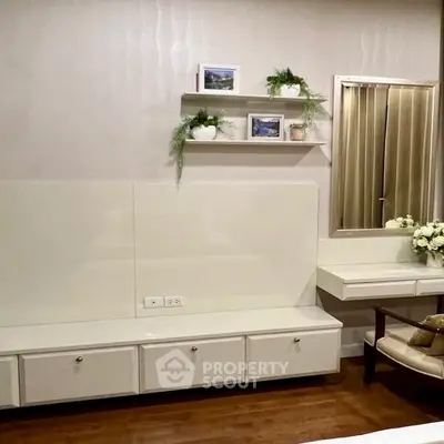 Elegant bedroom with modern white furniture and decorative plants