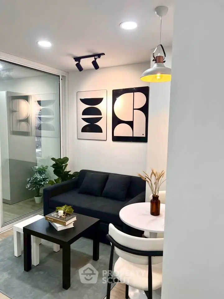 Modern living room with stylish decor and cozy seating area, perfect for relaxation and entertaining.